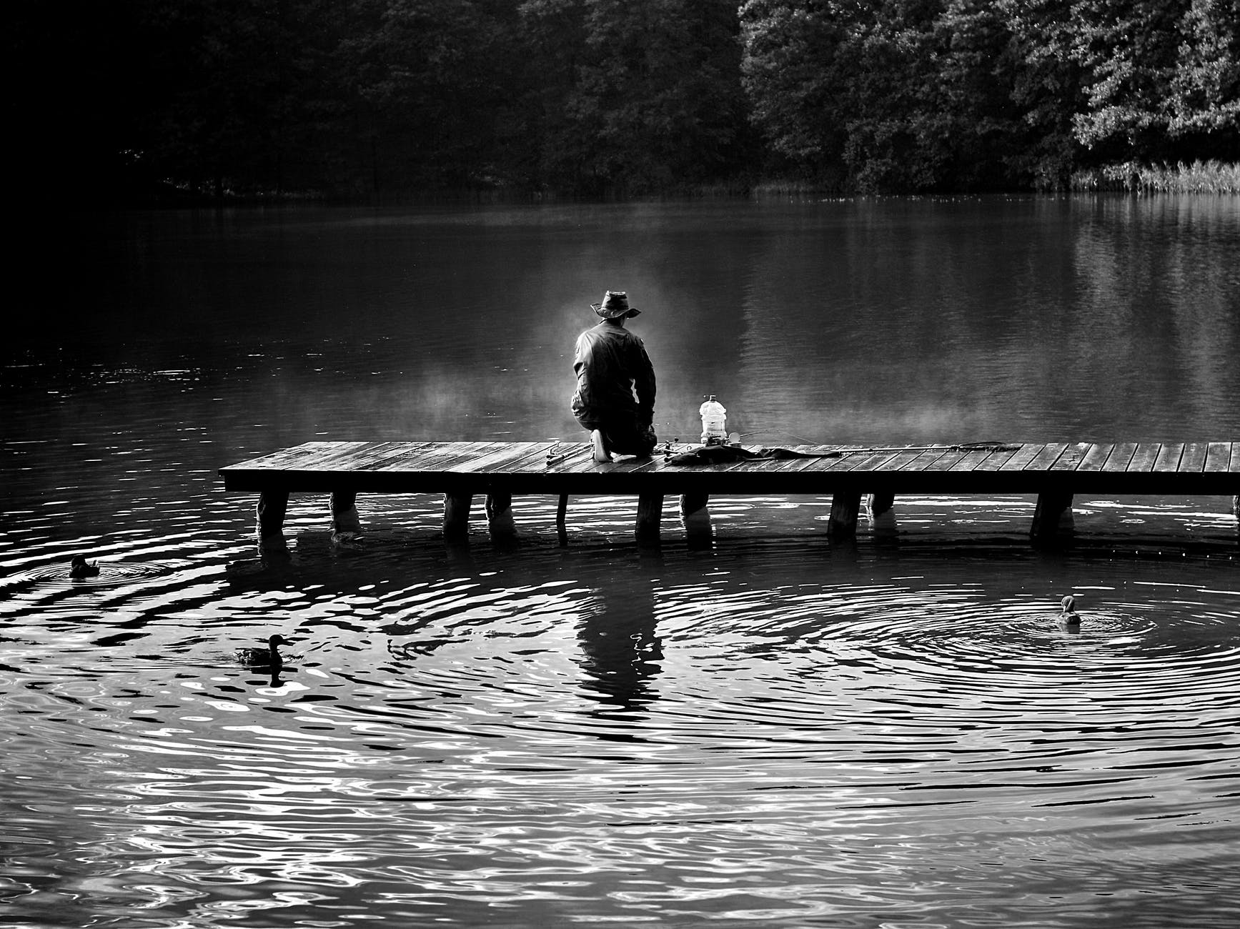 black and white dawn fish fisherman